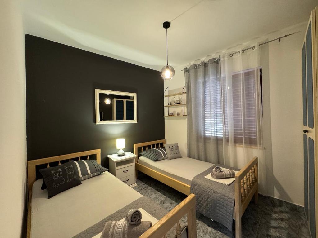 Postel nebo postele na pokoji v ubytování Apartmani Meri
