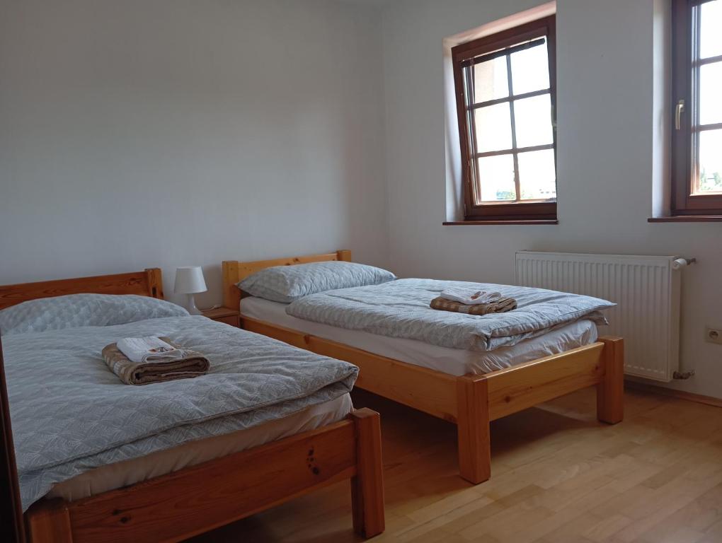 Postel nebo postele na pokoji v ubytování Tri Korunky