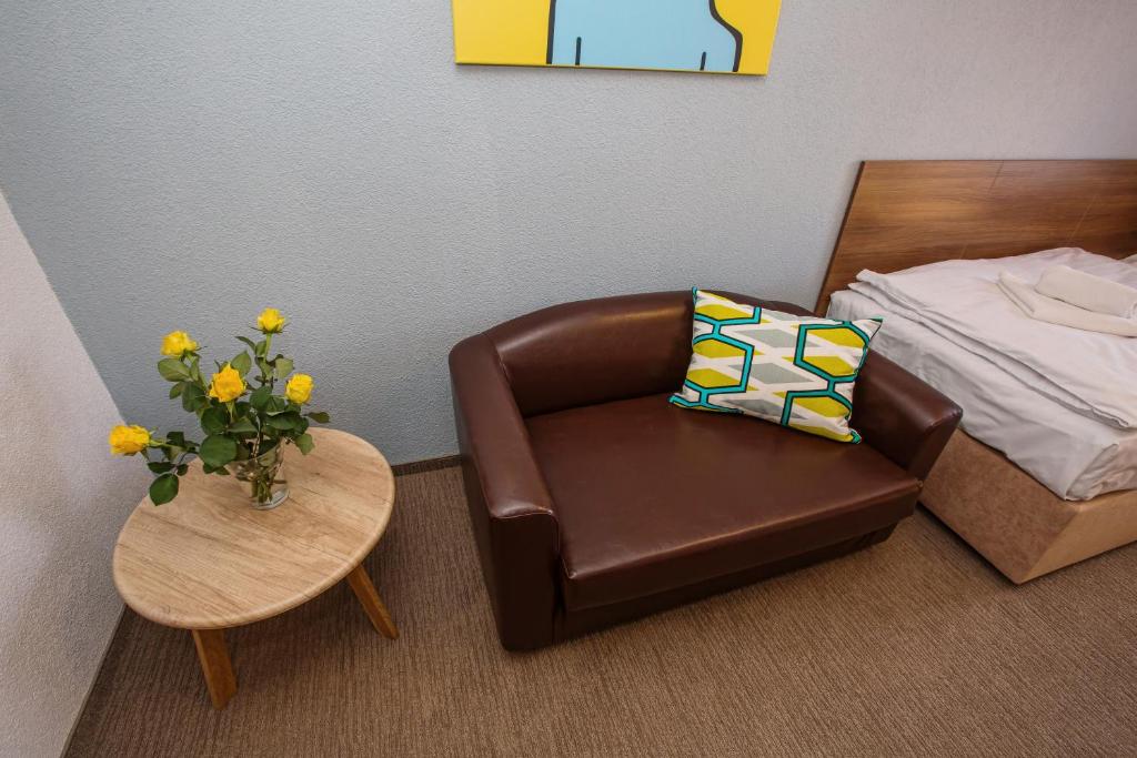 Postel nebo postele na pokoji v ubytování Hotel Na Šustně