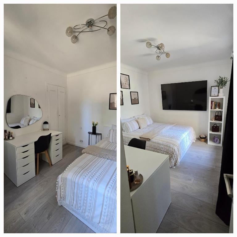 1 Schlafzimmer mit 2 Betten und einem Schreibtisch mit einem Spiegel in der Unterkunft Villa 4 pièces à Fréjus Plage 5 min plage, clim, parking & BBQ in Fréjus