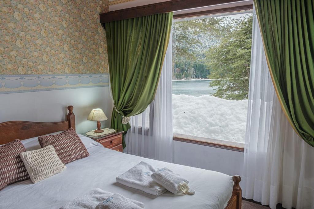 Postel nebo postele na pokoji v ubytování Hosteria El Condado