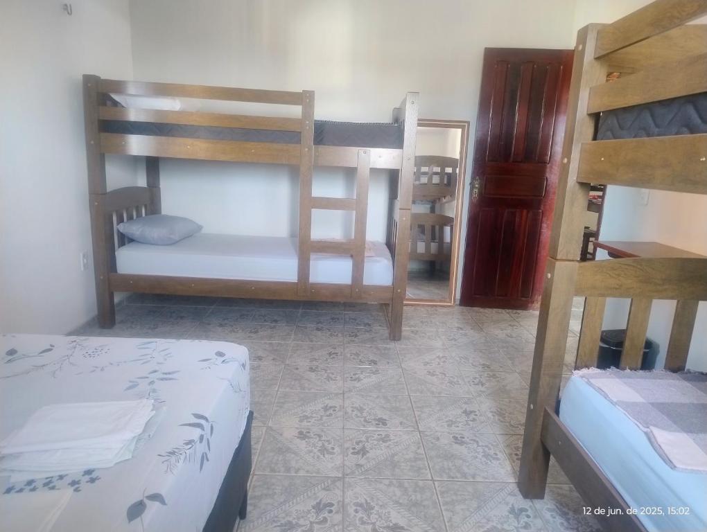 Postel nebo postele na pokoji v ubytování hostel xamã