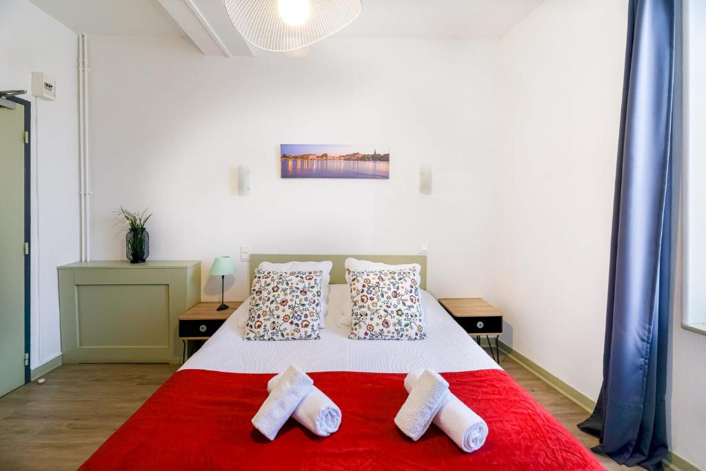 Postel nebo postele na pokoji v ubytování La Belle Hôtel