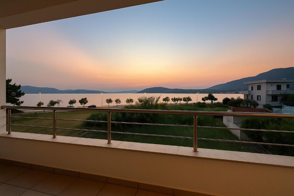 a view from the balcony of a condo at sunset at Sea & Salt ,Pelion,Agria Volos in Agria