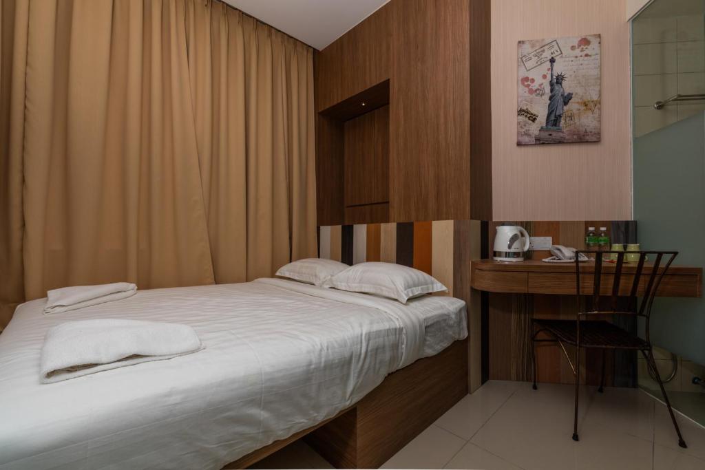 Gulta vai gultas numurā naktsmītnē Hotel 138 @ Subang