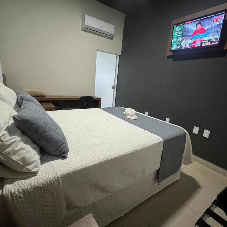 Postel nebo postele na pokoji v ubytování Pousada Brumado