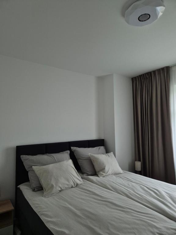 Łóżko lub łóżka w pokoju w obiekcie Brickstone Apartments Mabork