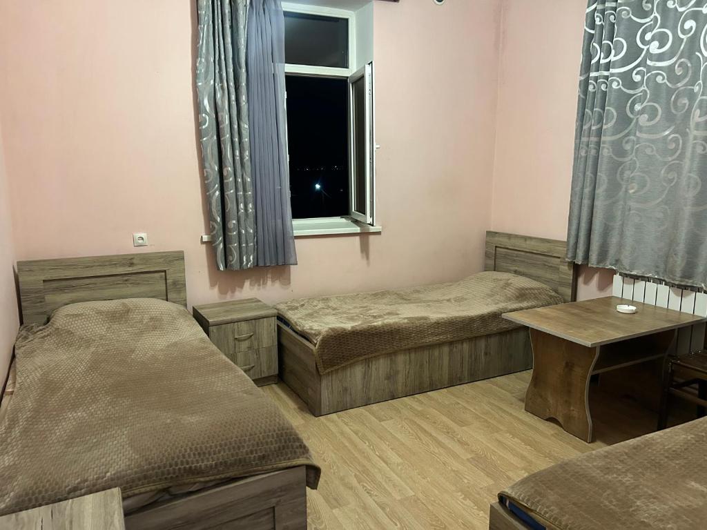 Postel nebo postele na pokoji v ubytování GM Hotel