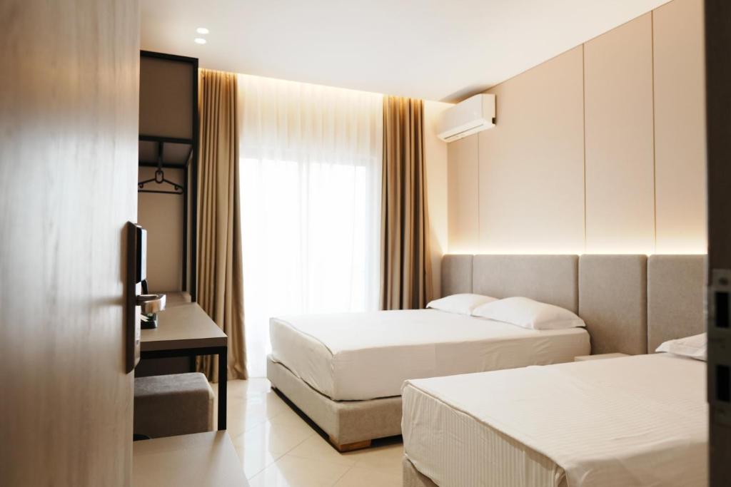 Postel nebo postele na pokoji v ubytování Hotel Mediterrane