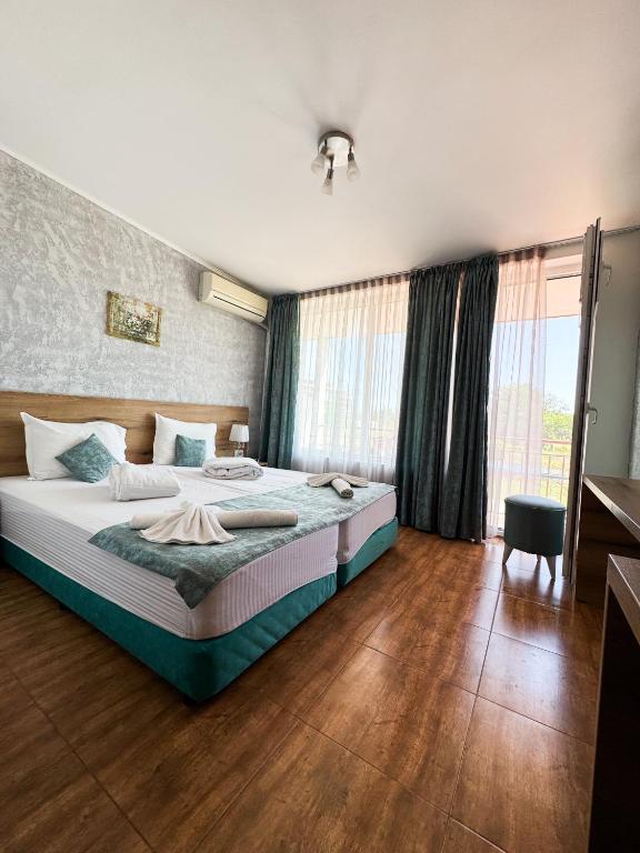 Postel nebo postele na pokoji v ubytování Hotel Surf Primorsko