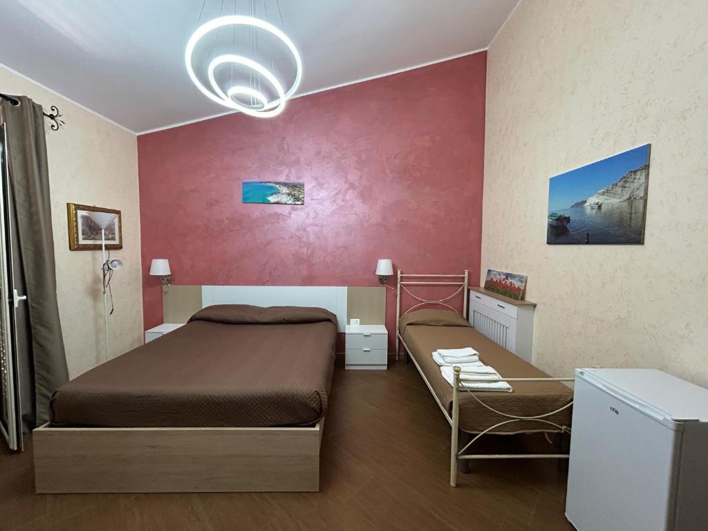 Giường trong phòng chung tại La Scala sul Giardino