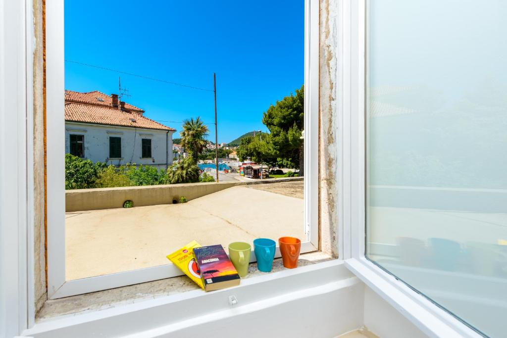 a window sill with a view of a street at Hostel EuroAdria in Dubrovnik