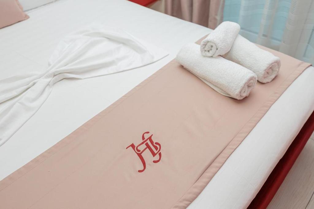 Postel nebo postele na pokoji v ubytování Laid Hotel