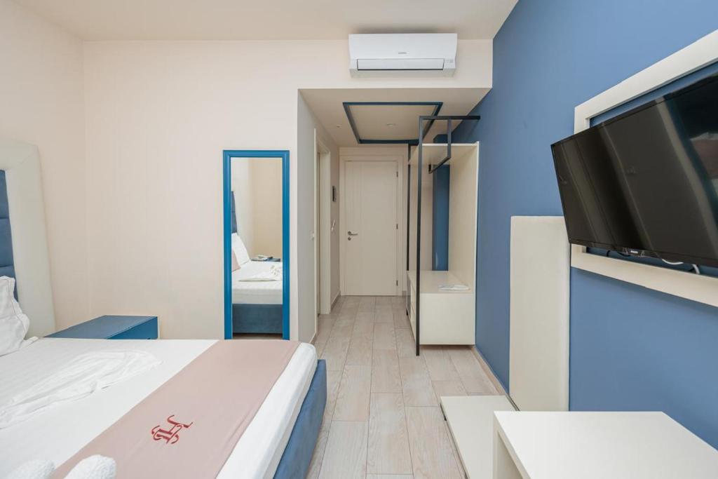 Postel nebo postele na pokoji v ubytování Laid Hotel