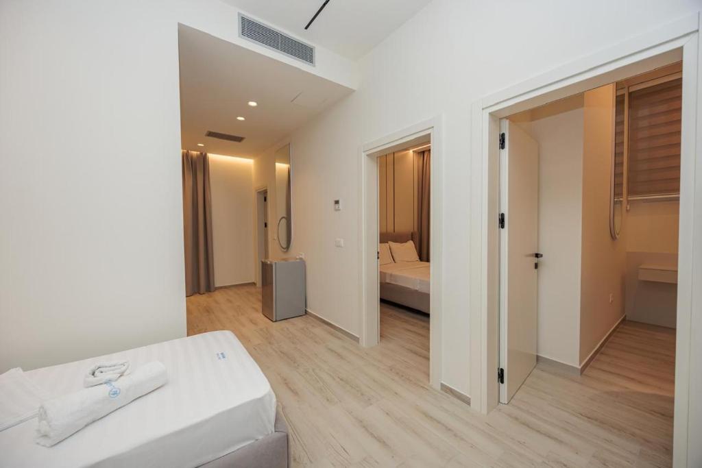 Postel nebo postele na pokoji v ubytování Laid Hotel