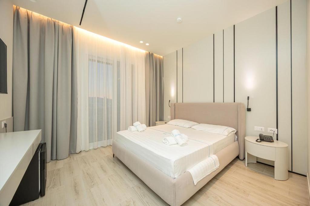 Postel nebo postele na pokoji v ubytování Laid Hotel