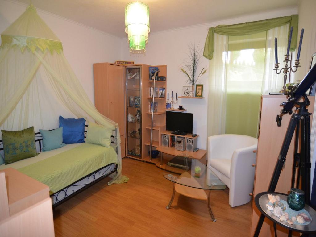 Postel nebo postele na pokoji v ubytování Quaint Apartment in Zeil am Main with Terrace