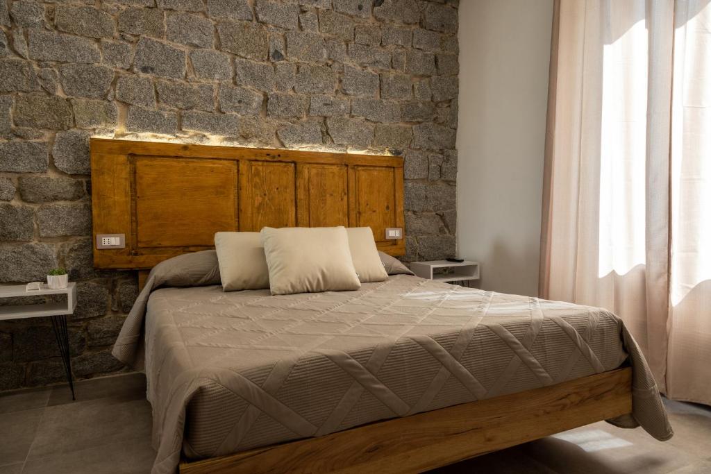 Postel nebo postele na pokoji v ubytování Nonnalena