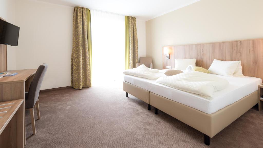 Postel nebo postele na pokoji v ubytování Hotel Marko