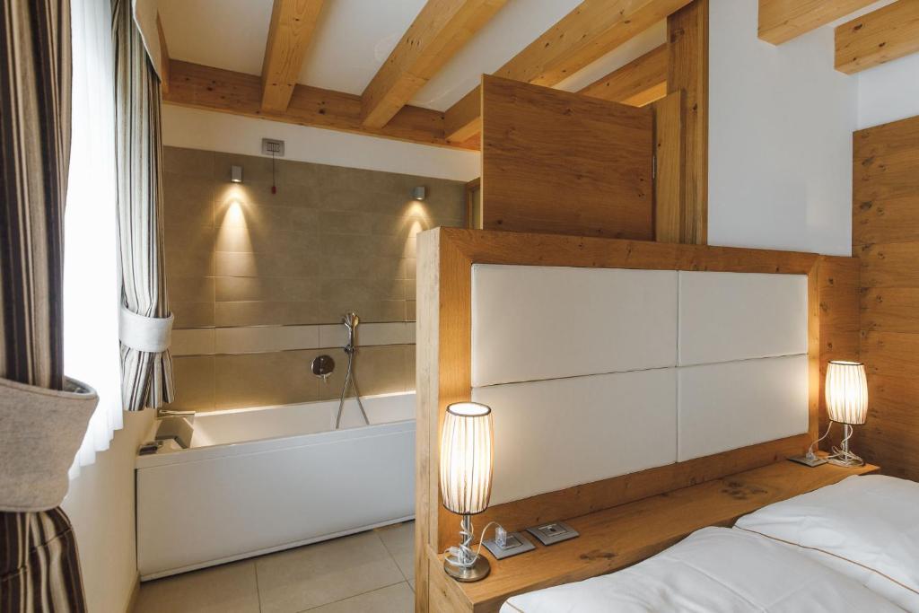 Postel nebo postele na pokoji v ubytování Sayonara Nature & Wellness Hotel