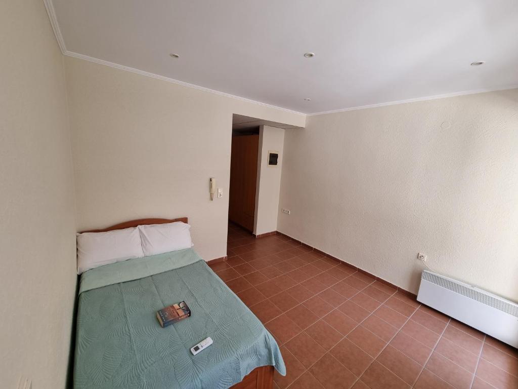 Postel nebo postele na pokoji v ubytování Astro Studio Apartments