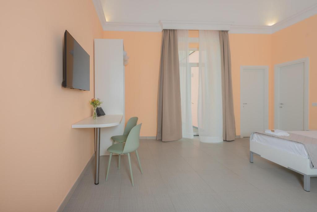 Postel nebo postele na pokoji v ubytování Aria Rooms