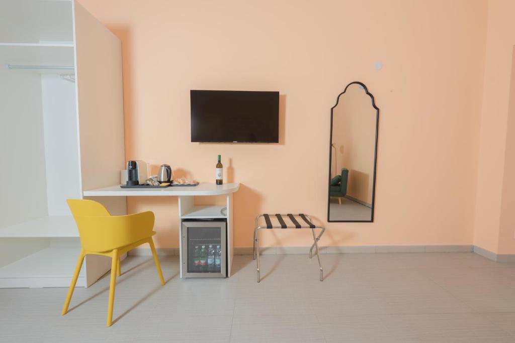 TV a/nebo společenská místnost v ubytování Aria Rooms