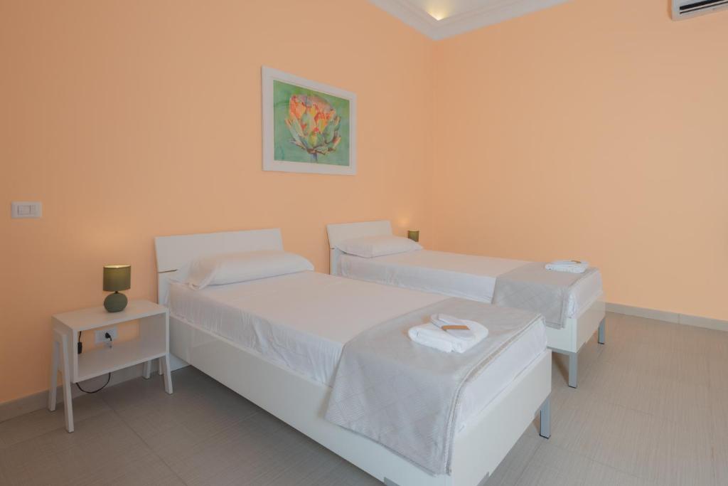Postel nebo postele na pokoji v ubytování Aria Rooms