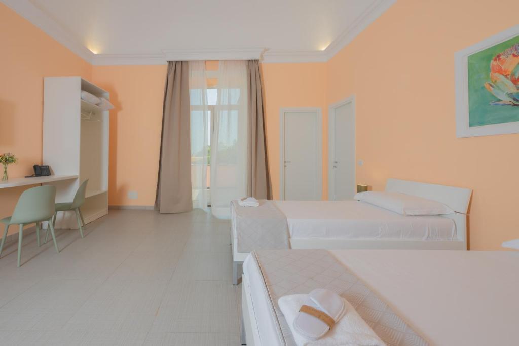 Postel nebo postele na pokoji v ubytování Aria Rooms