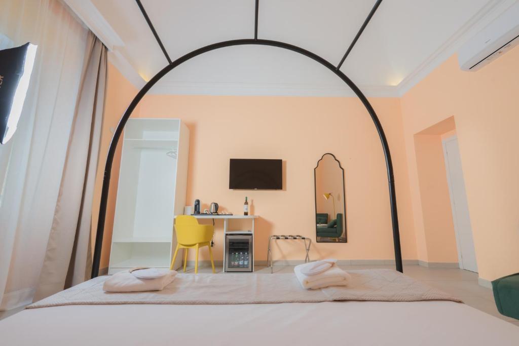 TV a/nebo společenská místnost v ubytování Aria Rooms
