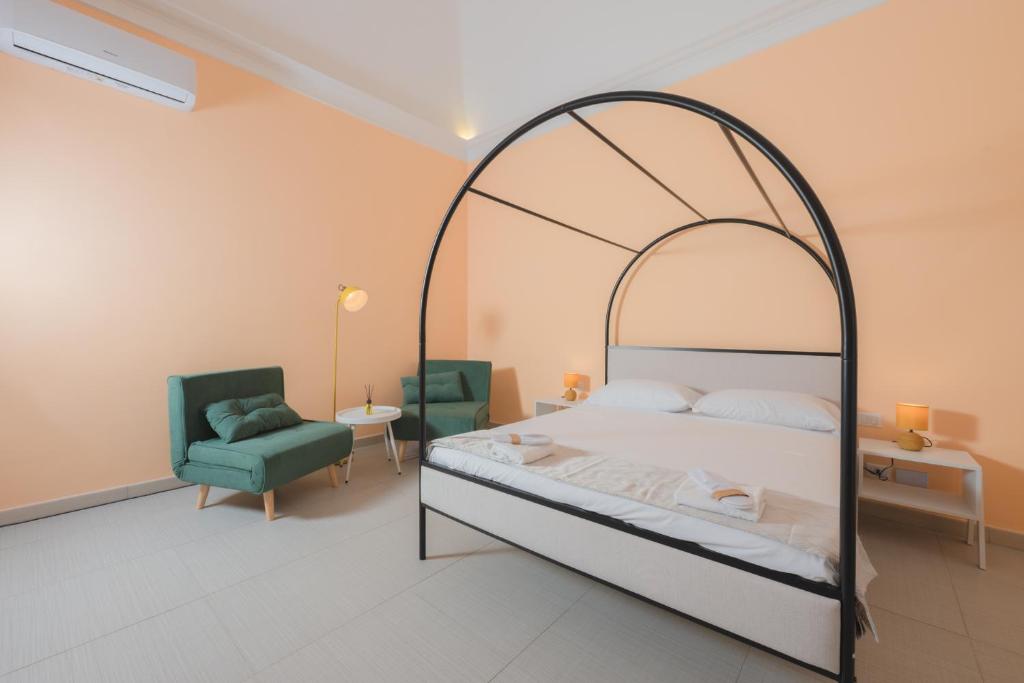 Postel nebo postele na pokoji v ubytování Aria Rooms