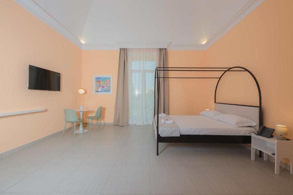 Postel nebo postele na pokoji v ubytování Aria Rooms