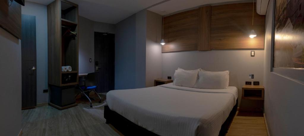 Postel nebo postele na pokoji v ubytování Hotel Blue Concept