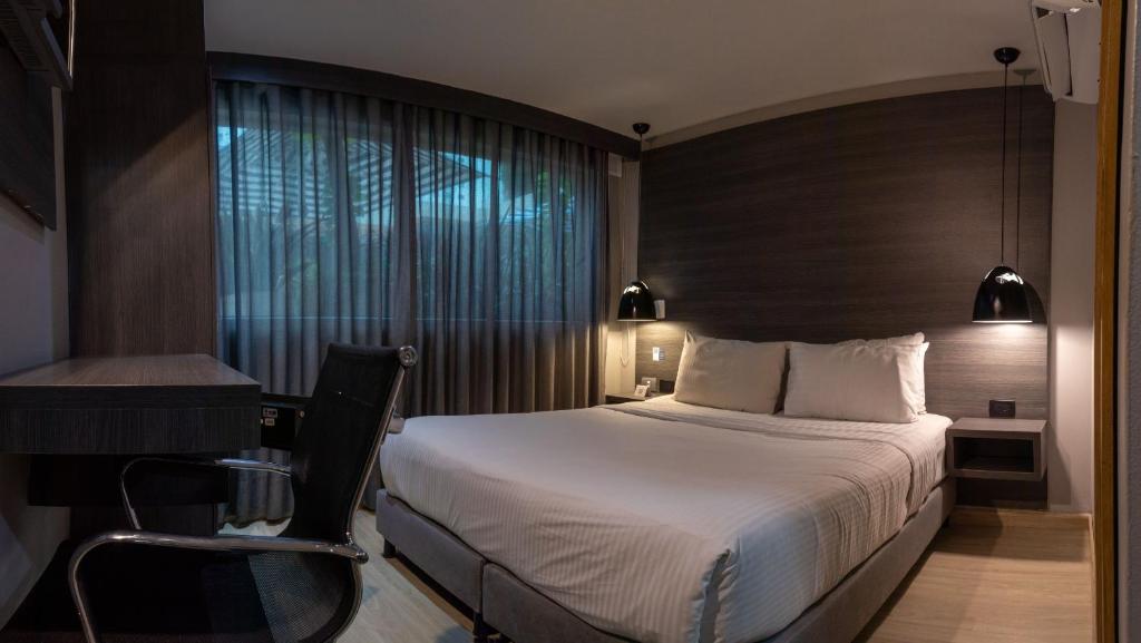 Postel nebo postele na pokoji v ubytování Hotel Blue Concept
