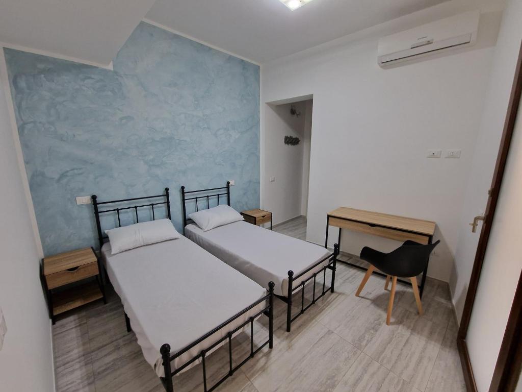 Postel nebo postele na pokoji v ubytování Agorà di Favignana