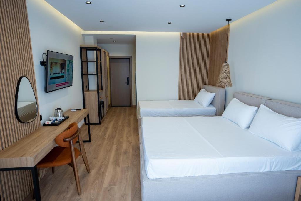 Postel nebo postele na pokoji v ubytování Rumar Hotel