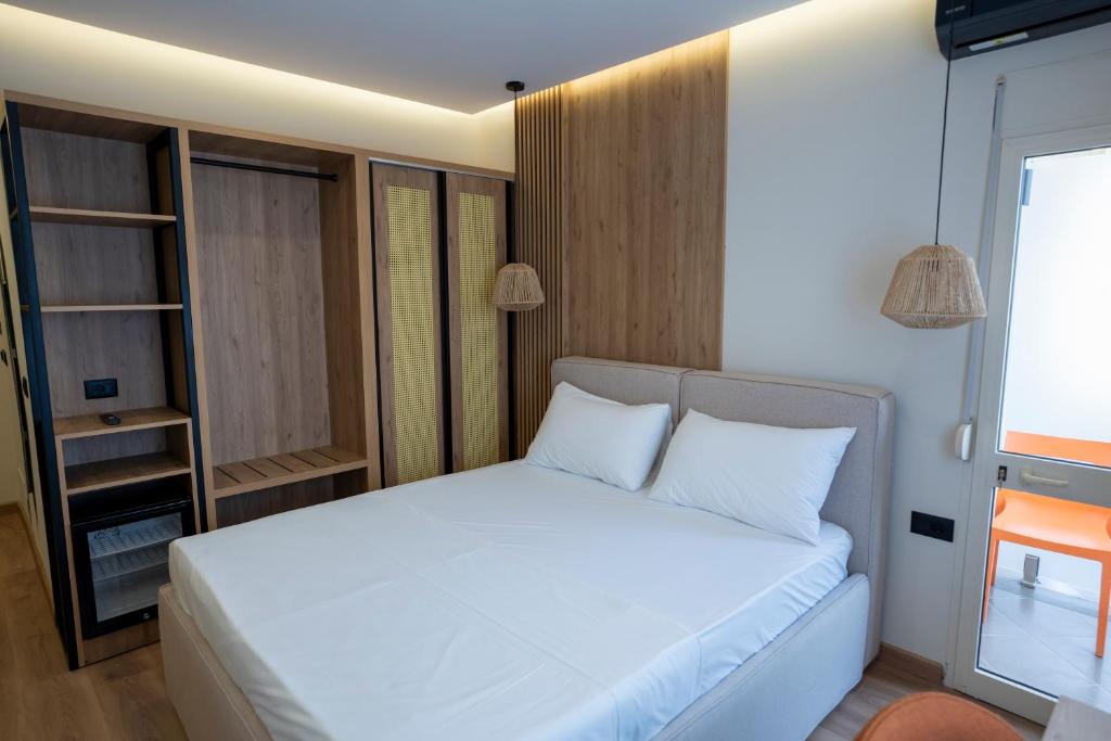 Postel nebo postele na pokoji v ubytování Rumar Hotel