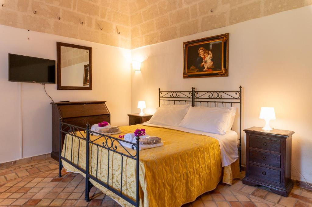 Postel nebo postele na pokoji v ubytování Agriturismo La Stornara