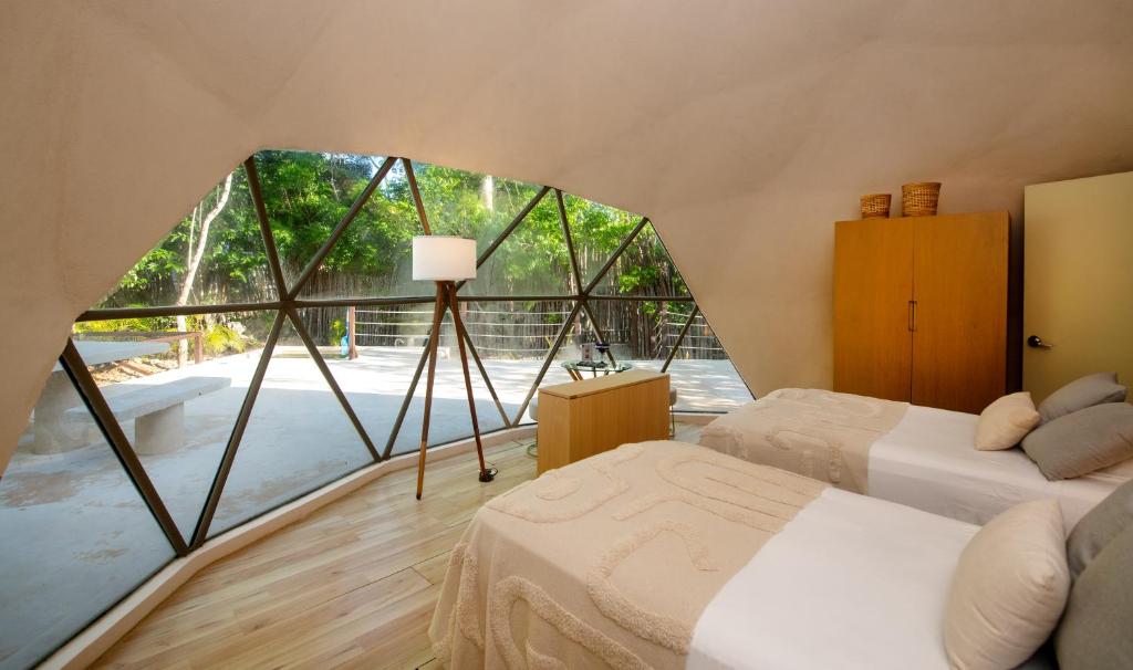 Postel nebo postele na pokoji v ubytování Alma Maya Resort - Riviera Maya