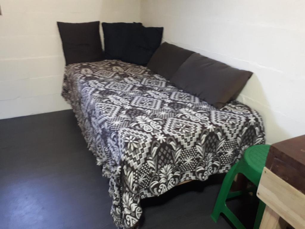Postel nebo postele na pokoji v ubytování Mini casa (kit net)