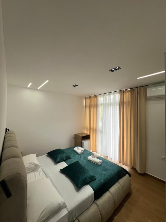 Postel nebo postele na pokoji v ubytování Adriatik Guesthouse