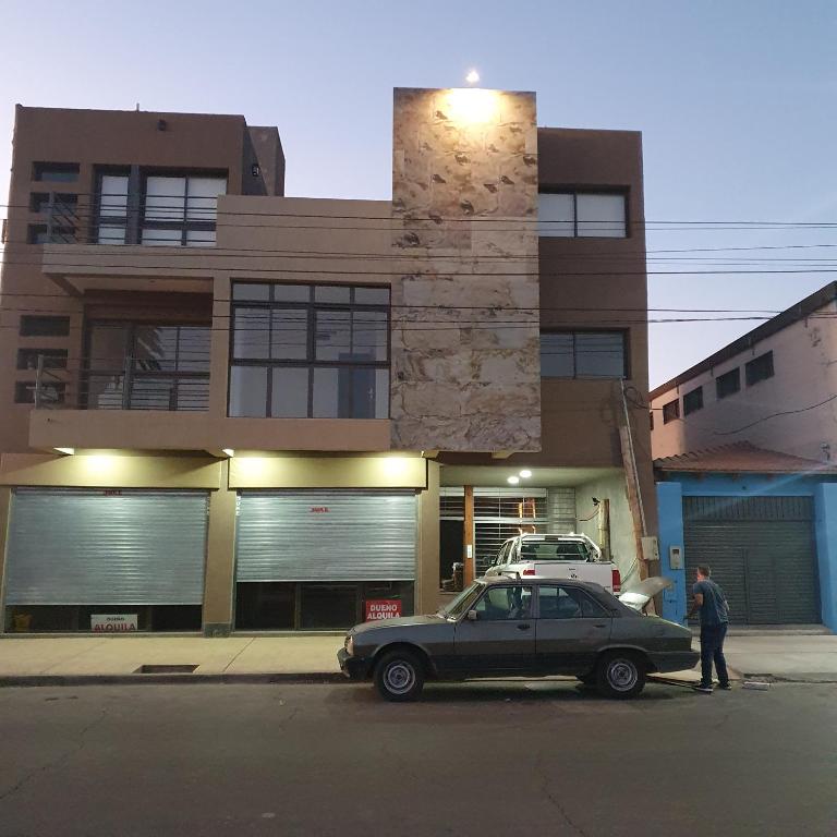 a car parked on the street in front of a building at pedro de valdivia 219 oeste in San Juan