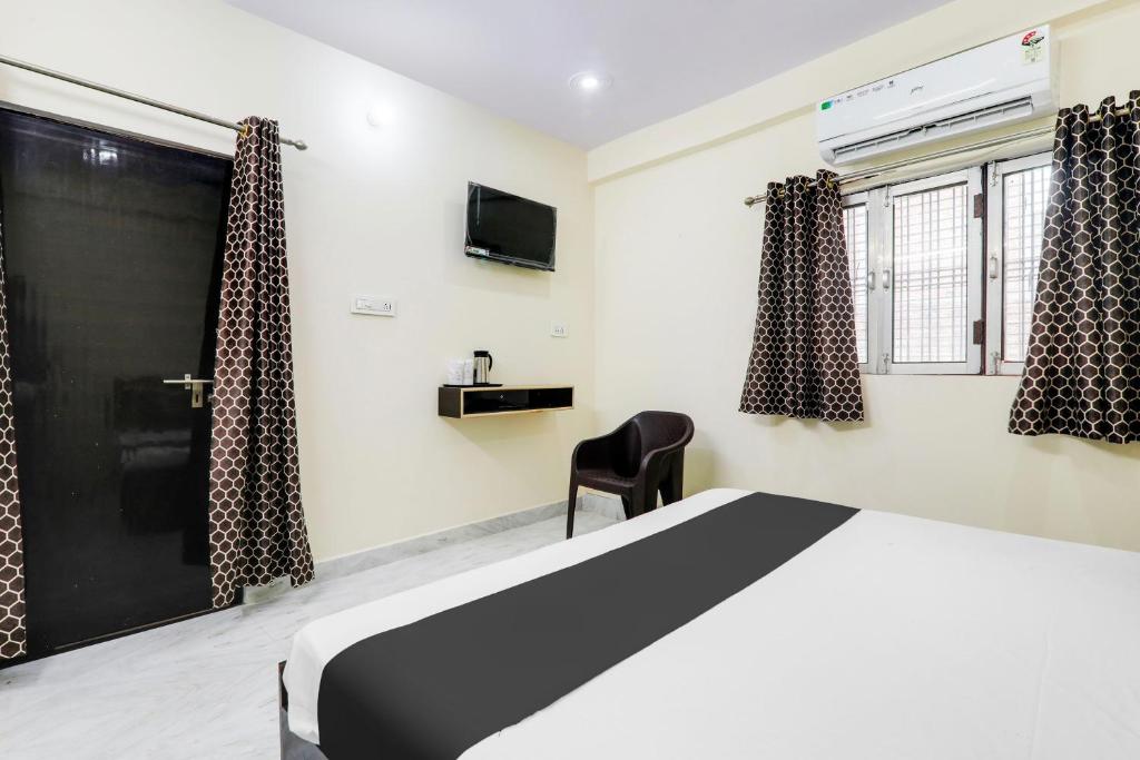 Postel nebo postele na pokoji v ubytování Hotel O Ramam