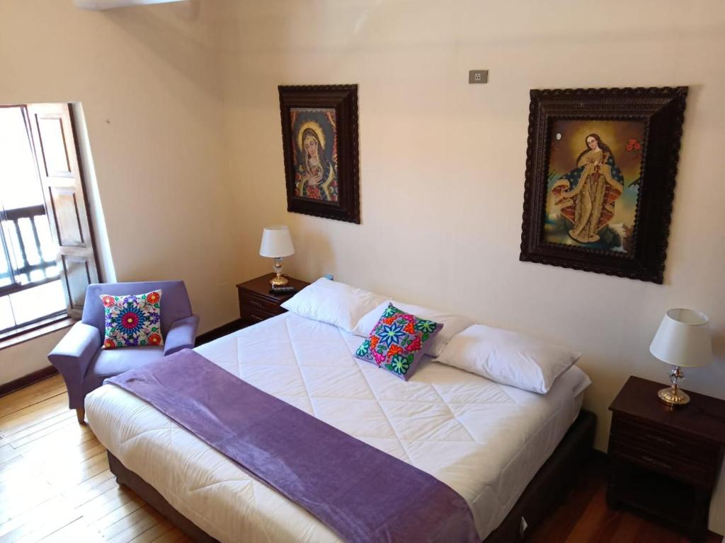 Ένα ή περισσότερα κρεβάτια σε δωμάτιο στο Casona Tupac Hotel Cusco