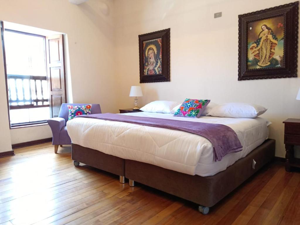 Ένα ή περισσότερα κρεβάτια σε δωμάτιο στο Casona Tupac Hotel Cusco
