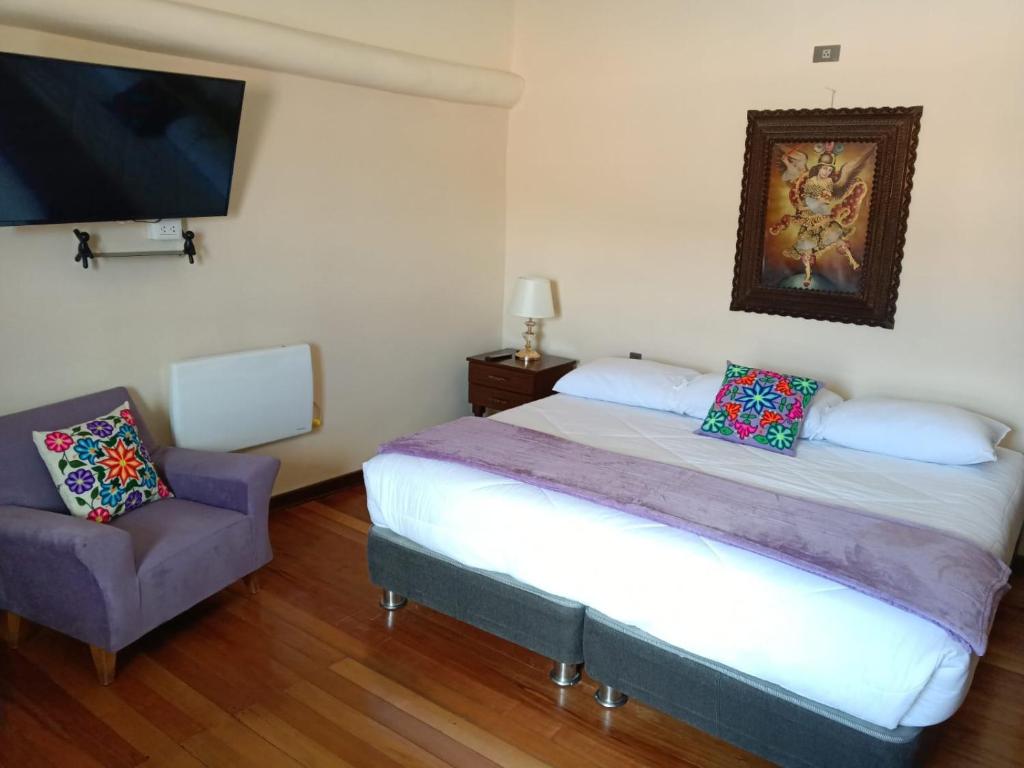 Ένα ή περισσότερα κρεβάτια σε δωμάτιο στο Casona Tupac Hotel Cusco