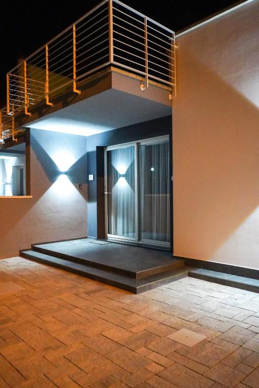 a building with a staircase on the side of it at L'Angolo di Mimma in Porto Cesareo