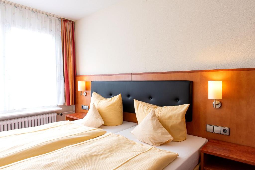 Postel nebo postele na pokoji v ubytování Hotel Fernblick