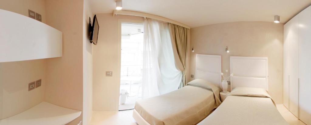 Кровать или кровати в номере Suite & Spa Mirabel