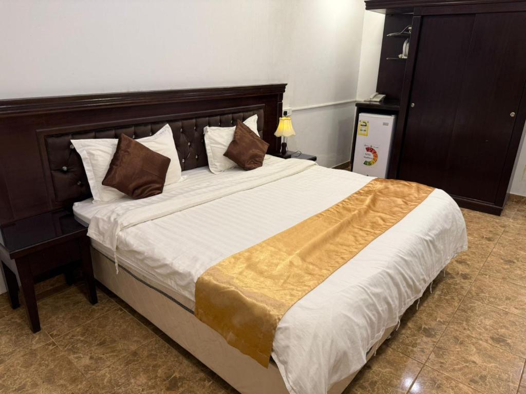 Postel nebo postele na pokoji v ubytování نسمة ديم للوحدات السكنية